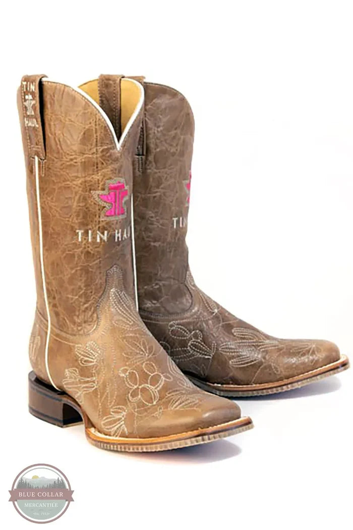 Tin Haul 14-021-0102-5088 TA Women's Cacatillow Western Boots - Broad Square Toe both standing up with tin haul logo in pink