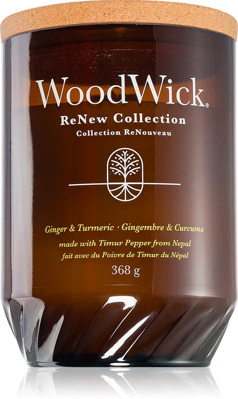 Woodwick Ginger & Tumeric scented candle with a wooden wick, showcasing a glass jar and warm, inviting candle flame.
