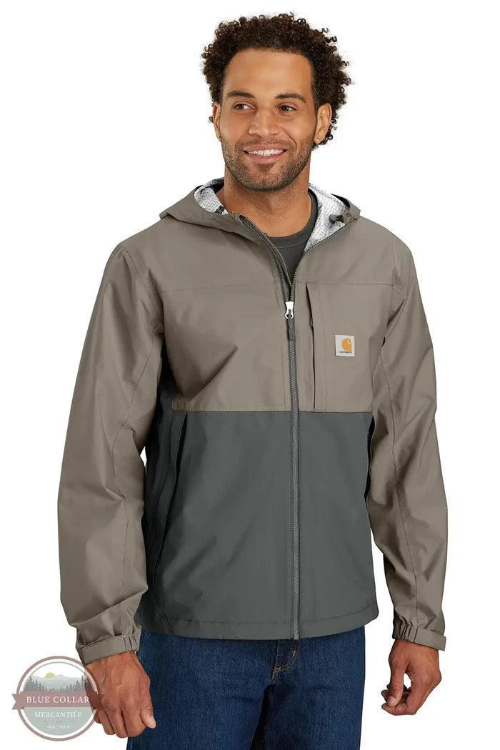 Carhartt 105751-B83 Storm Defender Relaxed Fit Lightweight Packable Jacket in tan/gray, model front view