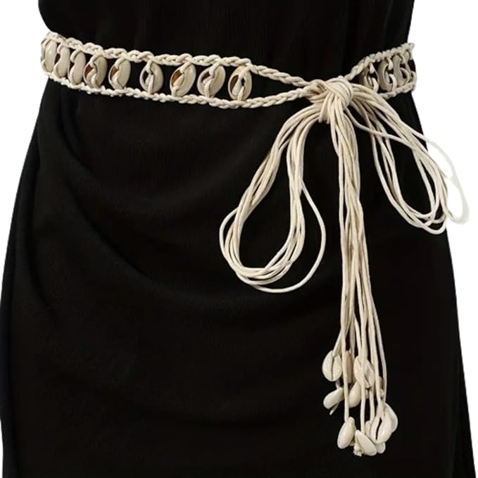 Ani Accessories Womens Belt Close-up of a braided beige belt with woven cowrie shells. Features decorative tassels with cowrie shell ends.