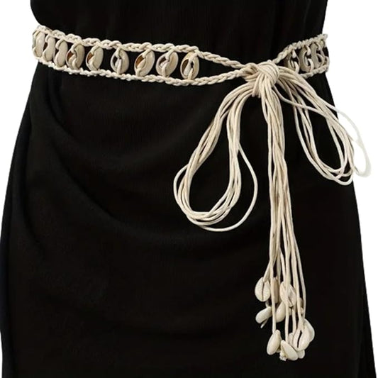 Ani Accessories Womens Belt Close-up of a braided beige belt with woven cowrie shells. Features decorative tassels with cowrie shell ends.