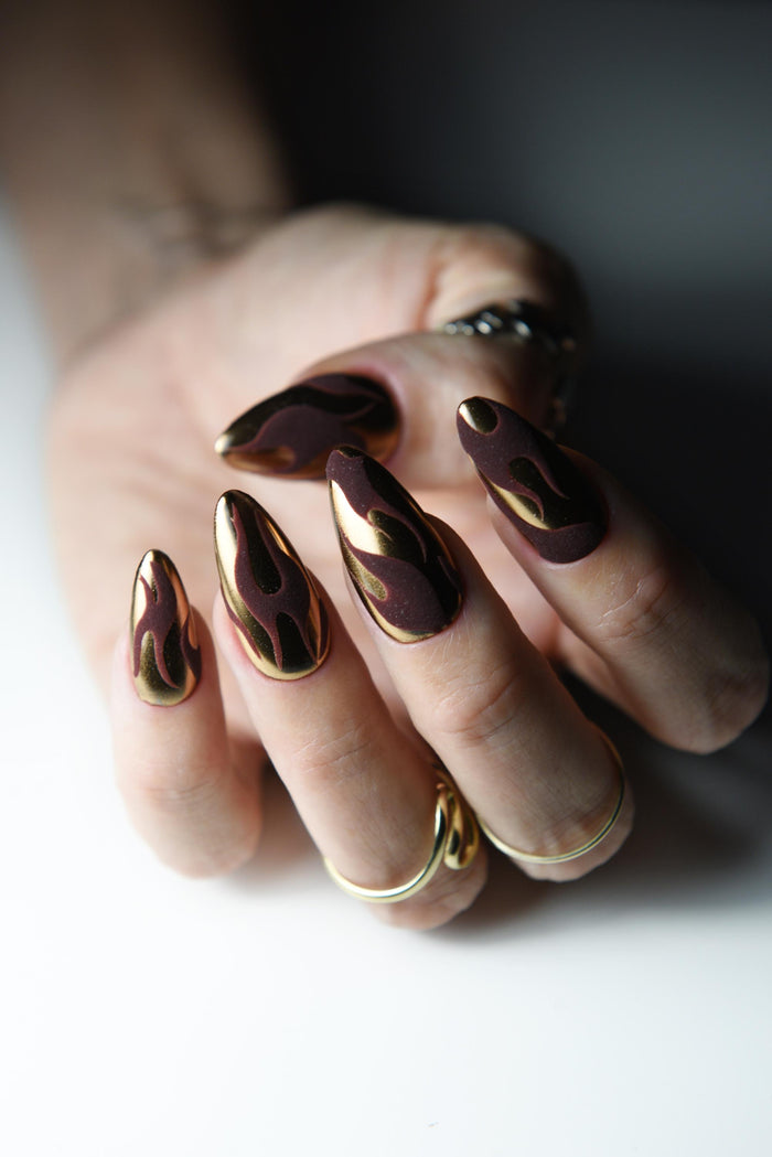 Bronze copper mirror chrome press-on nails with dark matte flame art – detail view