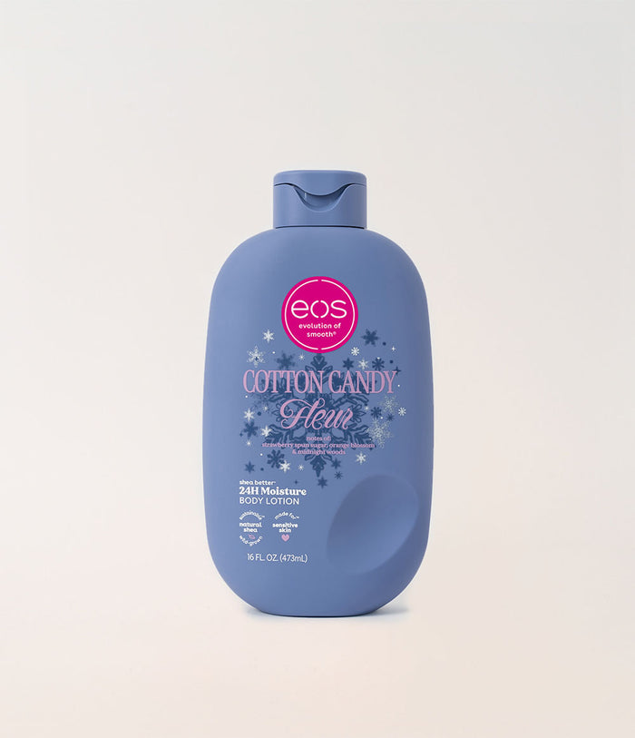 A bottle of EOS Cotton Candy Moisturizing Body Lotion in a dusty blue bottle with a pink and white label, centered on a light beige background.