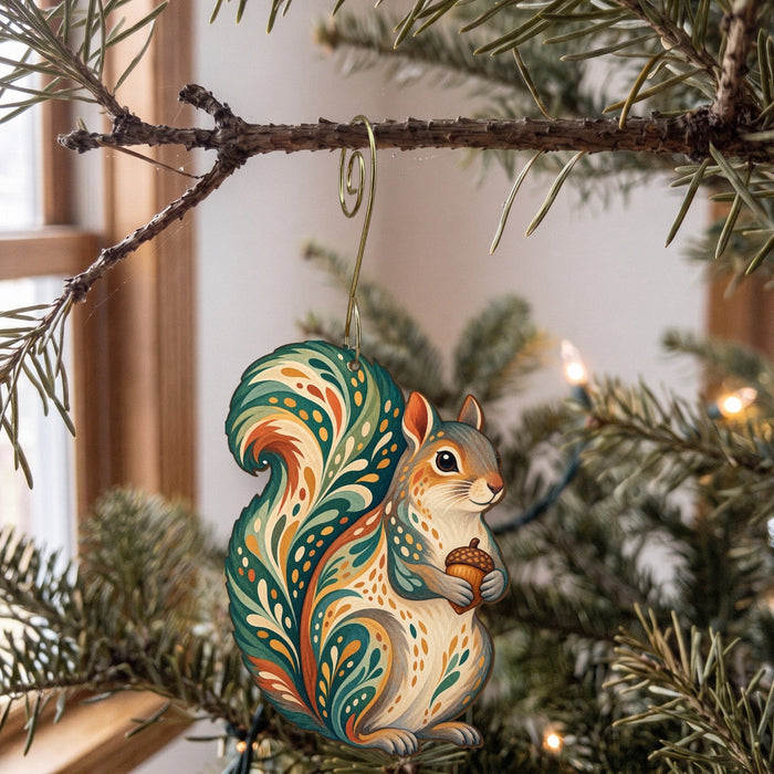 Laser-cut maple wood Eastern Gray Squirrel folk art ornament O283 hanging on a fir branch, made in USA