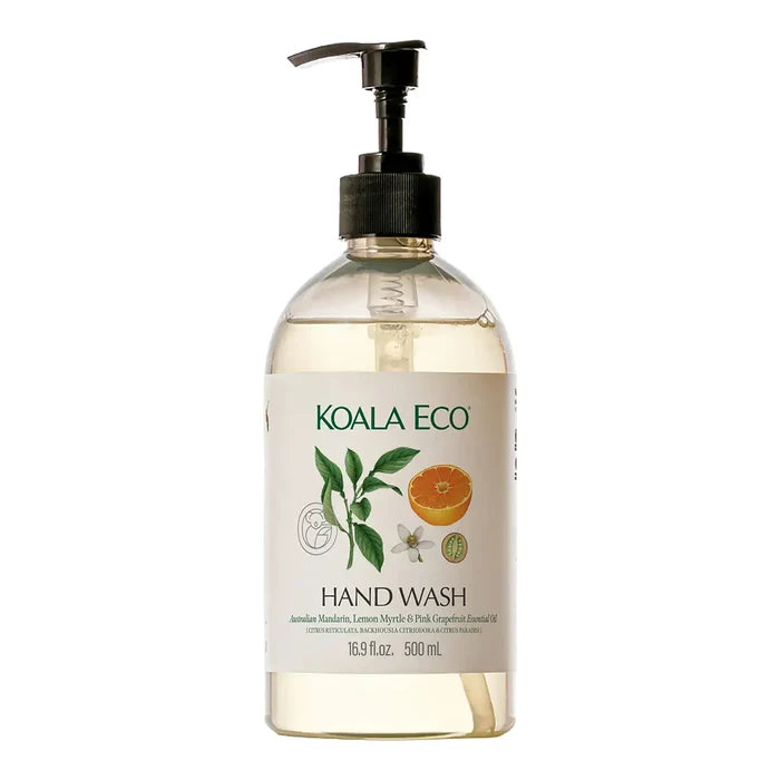 A 500ml bottle of Koala Eco hand wash with a black pump dispenser, featuring a white label with green text and illustrations of a lemon myrtle leaf and orange slice.