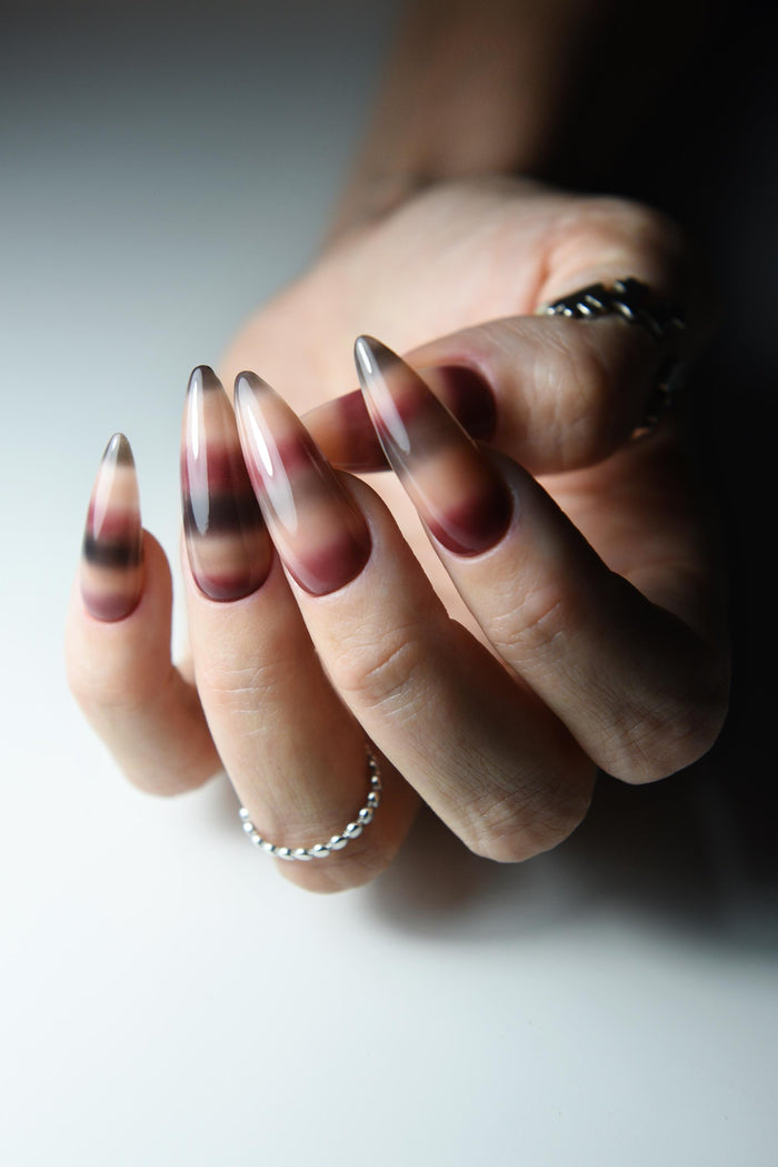 Hand-painted mohair sweater-inspired press-on nails in long almond shape – detail view