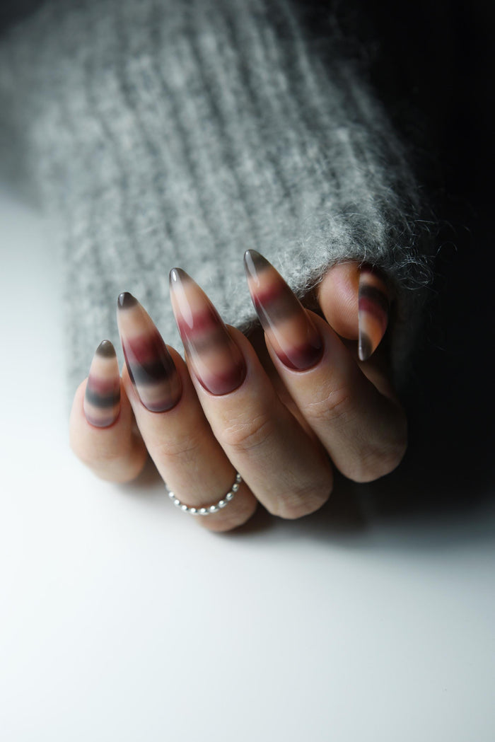 Hand-painted mohair sweater-inspired press-on nails in long almond shape – detail view