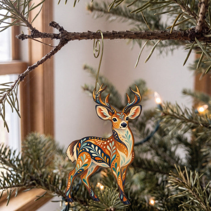 Laser-cut maple wood Mule Deer folk art ornament O242 hanging on a fir branch, made in USA