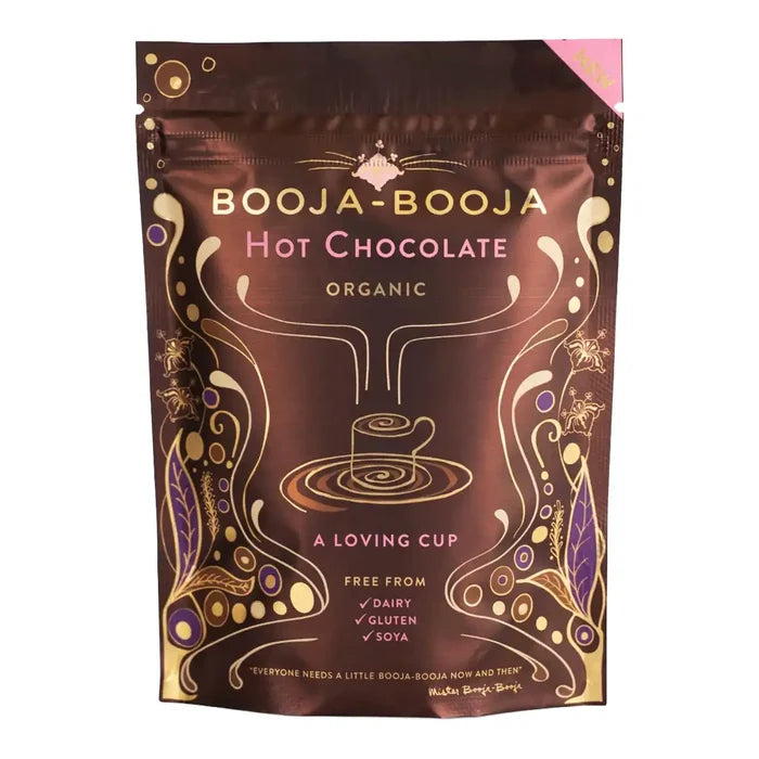 A stand-up pouch of Booja-Booja Organic Hot Chocolate on a plain white background. The packaging is dark brown with gold and pink decorative text and swirls, and a small pink corner tab is visible at the top right.