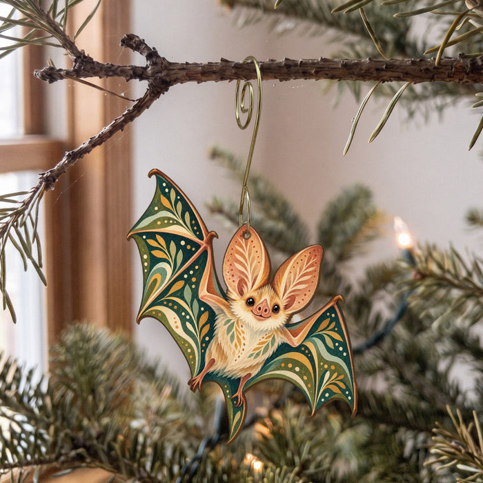 Laser-cut maple wood Pallid Bat folk art ornament O291 hanging on a fir branch, made in USA