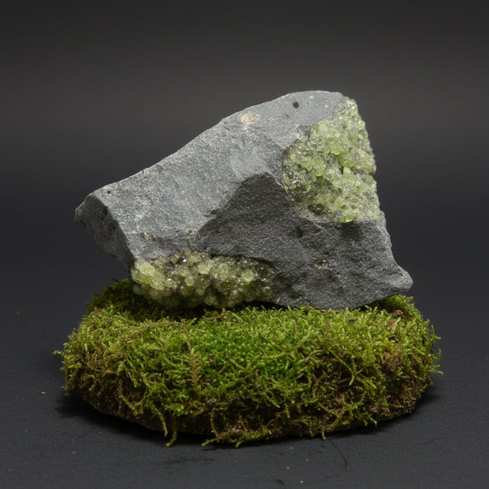 Mineral sample with green peridot crystals