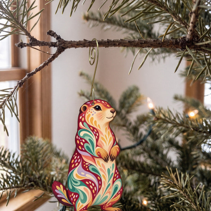 Laser-cut maple wood Prairie Dog folk art ornament O278 hanging on a fir branch, made in USA