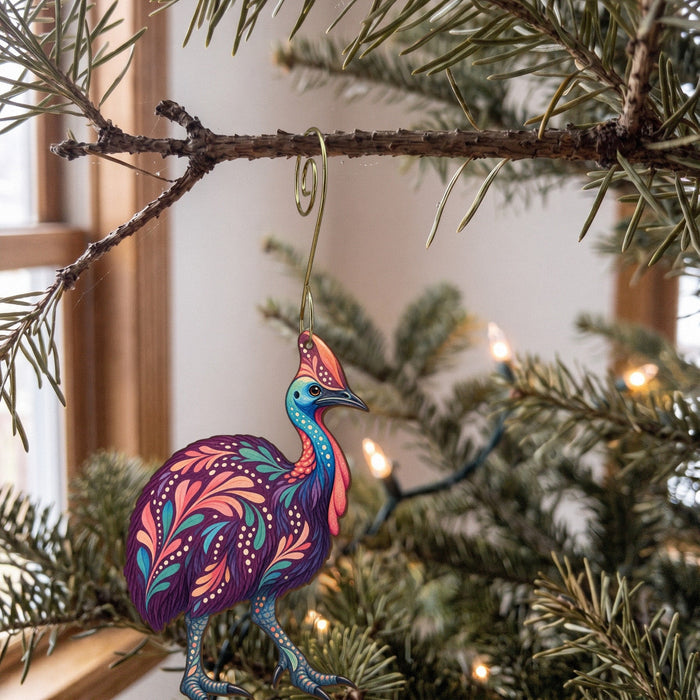 Laser-cut maple wood Southern Cassowary folk art ornament O524 hanging on a fir branch, made in USA