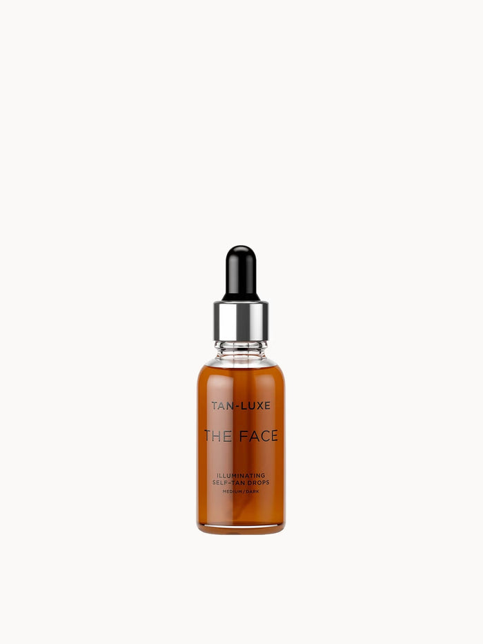 Tan-Luxe The Face Illuminating Self-Tan Drops in 30ml medium/dark, featuring a sleek bottle with dropper for natural sun-kissed glow