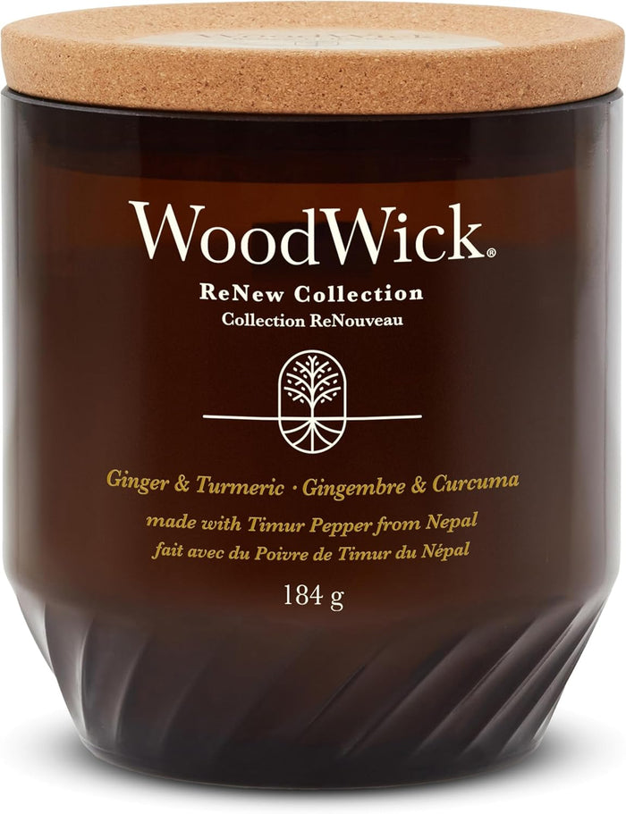 Woodwick Renew Ginger & Tumeric scented candle with wooden wick, 184g, showcasing the candle's warm amber-colored wax and wooden wick.